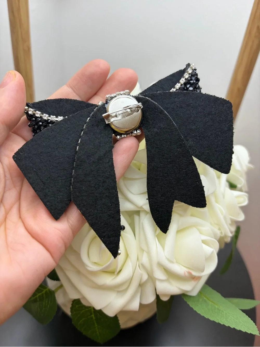 Black Crystal Bow Brooch with Silver Rhinestone Trim